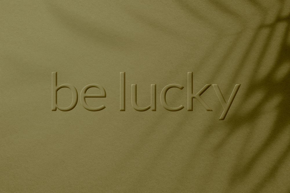 Plant shadow textured backdrop embossed be lucky message typography
