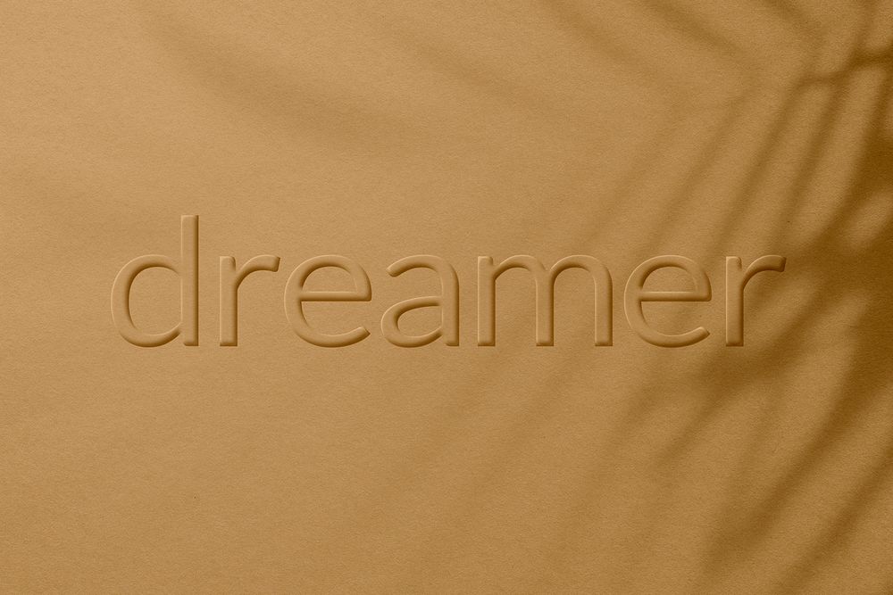 Embossed dreamer letter plant shadow textured backdrop typography