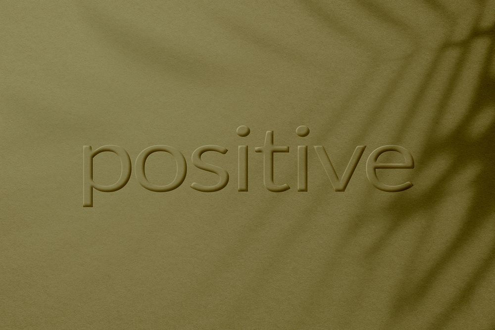 Word positive embossed textured typography