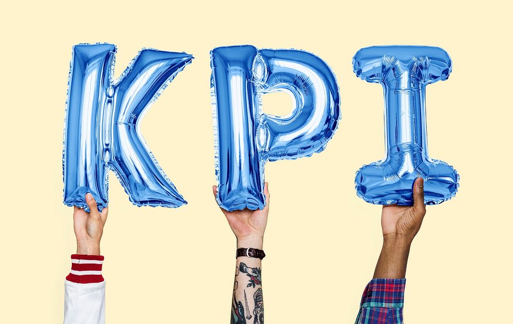 Hands holding KPI word in balloon letters