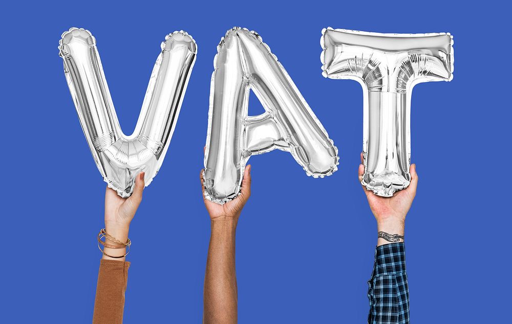Hands holding VAT word in balloon letters