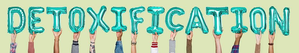 Hands holding detoxification word in balloon letters