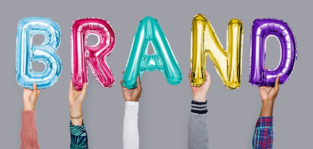 Hands showing brand balloons word