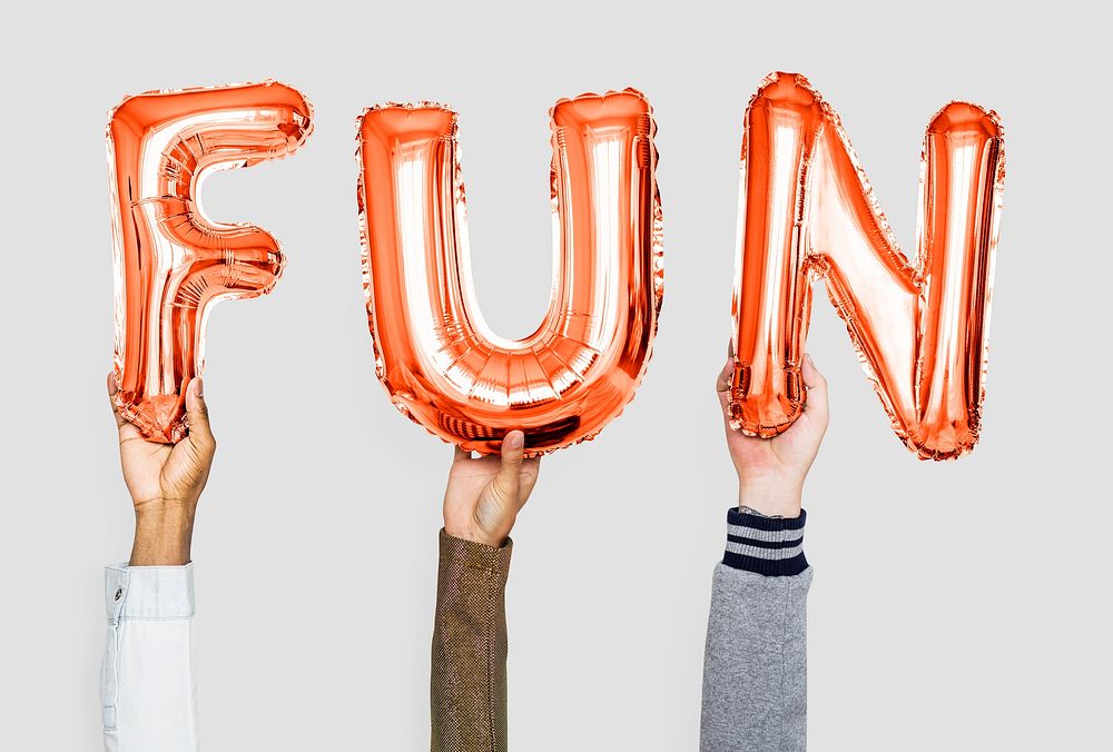 Orange alphabet balloons forming the word fun