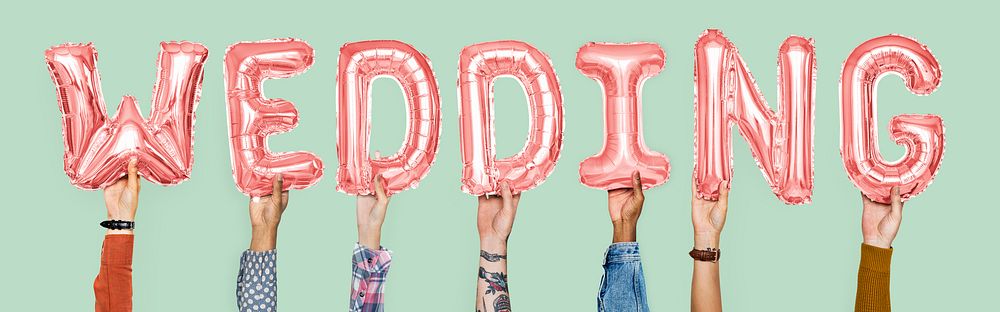 Pink alphabet balloons forming the word wedding