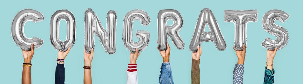 Silver gray alphabet balloons forming the word congrats