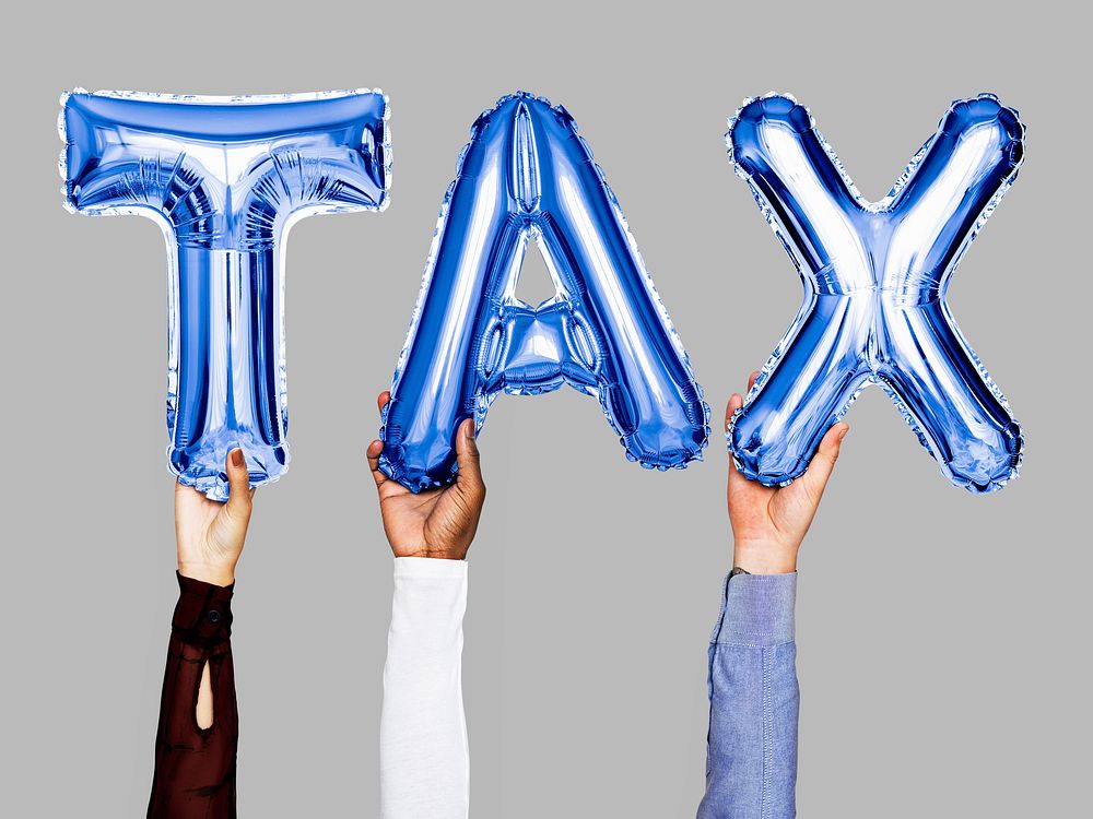 Hands showing tax balloons word