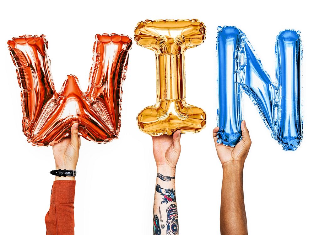 Hands showing win balloons word