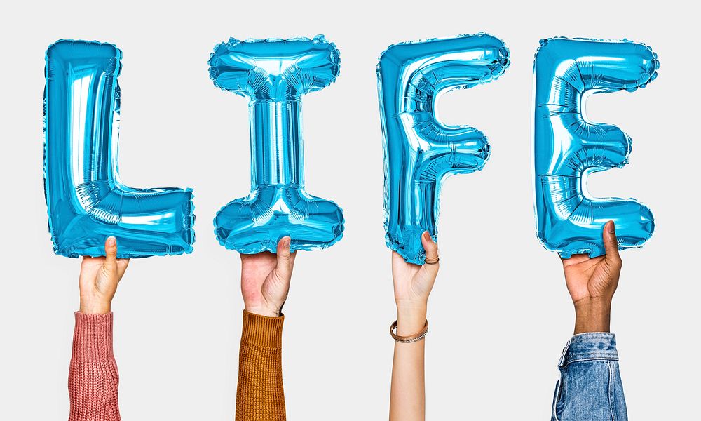 Hands showing life balloons word