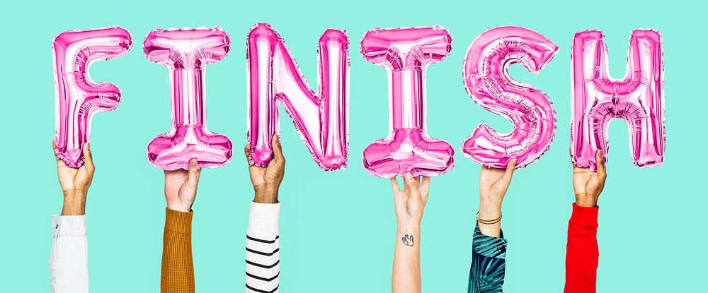 Hands holding finish word in balloon letters