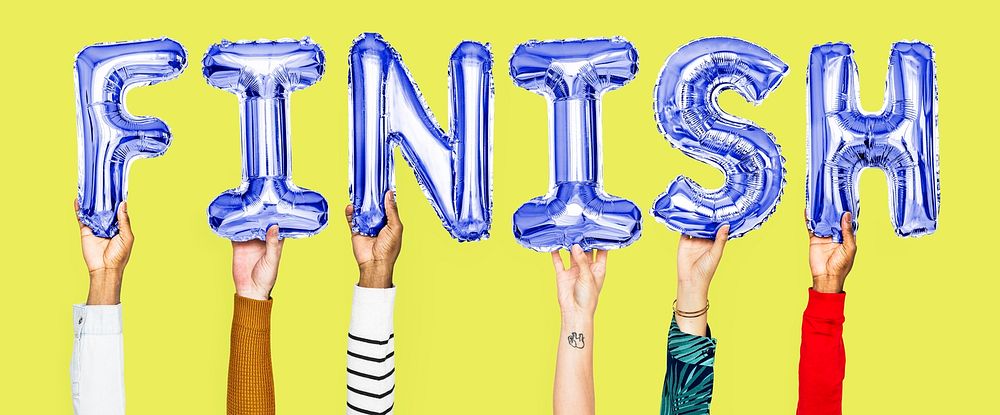 Hands holding finish word in balloon letters