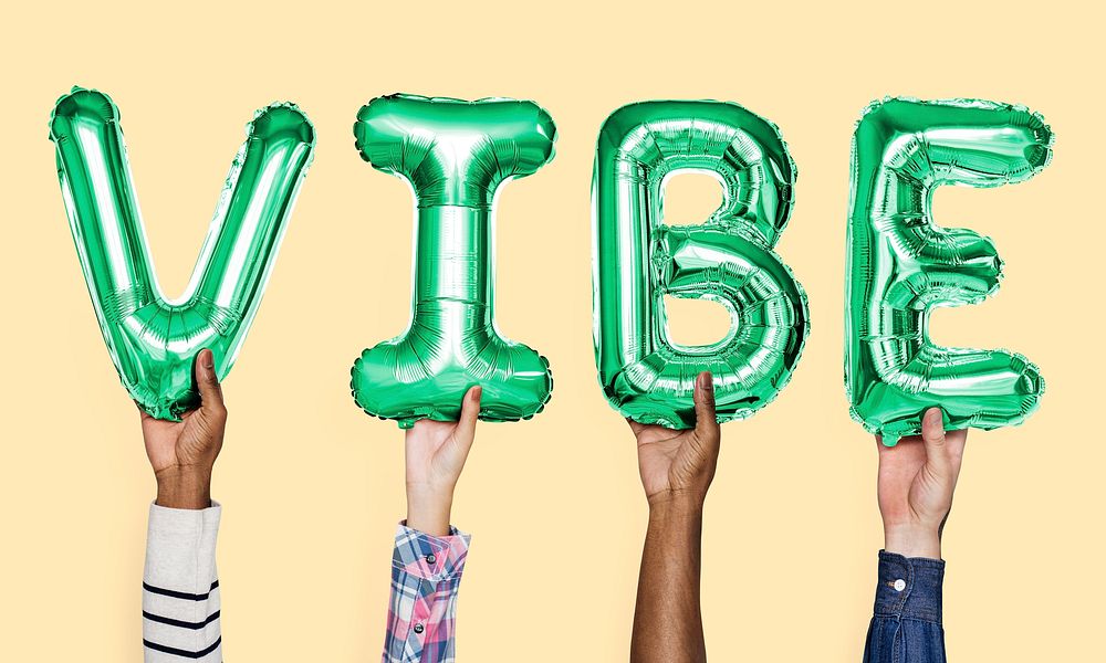 Green alphabet balloons forming the word vibe