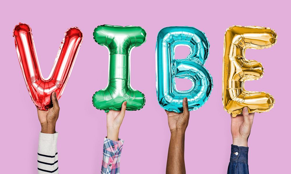 Colorful alphabet balloons forming the word vibe