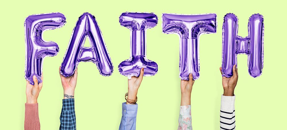 Hands holding faith word in balloon letters