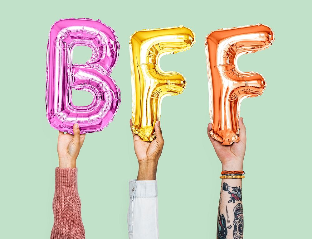 Hands holding BFF word in balloon letters