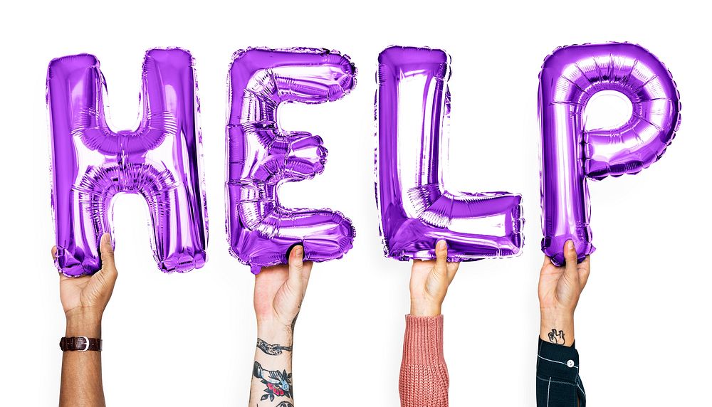 Purple alphabet balloons forming the word help