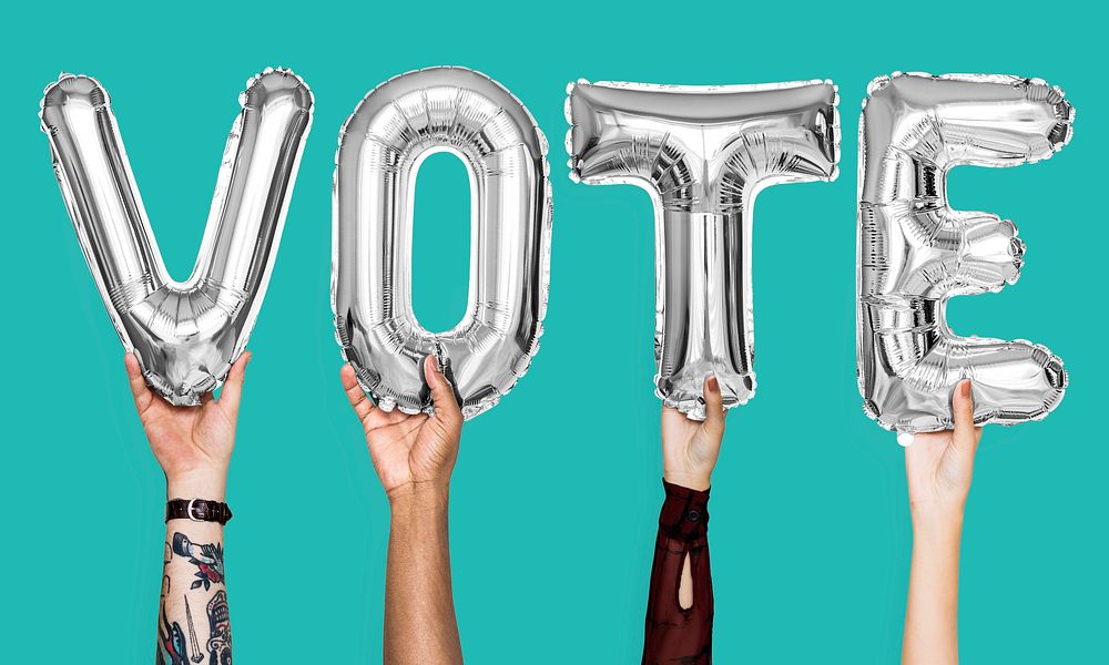 Silver gray alphabet balloons forming the word vote
