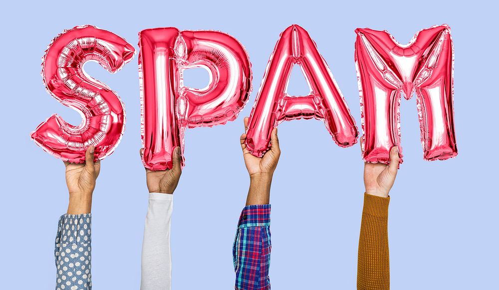Hands holding spam word in balloon letters