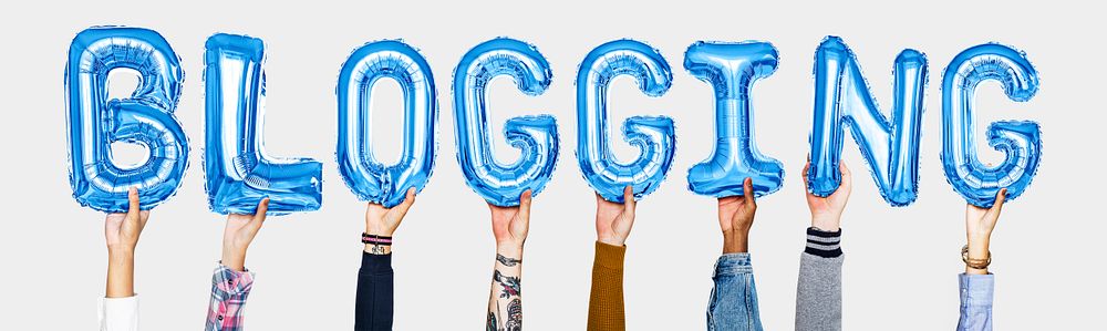 Hands holding blogging word in balloon letters