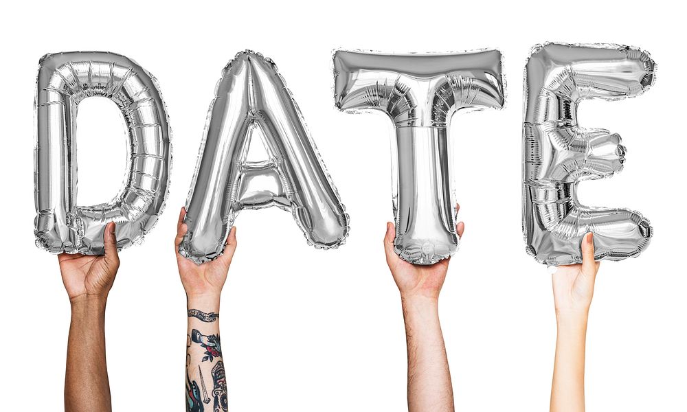 Silver gray alphabet balloons forming the word date