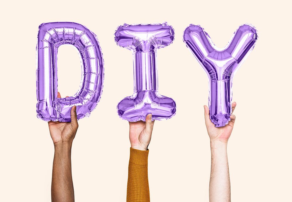 Hands holding balloons spelling DIY
