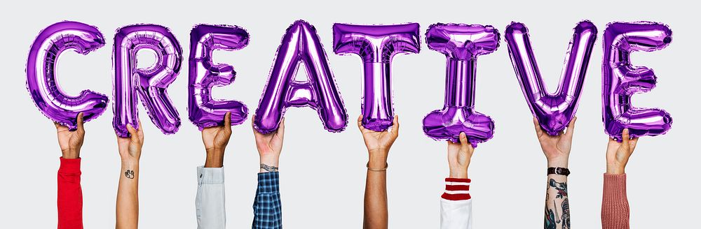 Purple alphabet helium balloons forming the text creative
