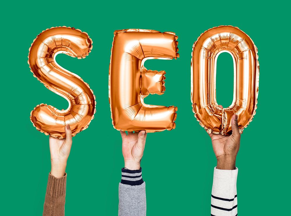 Orange balloon letters forming the word SEO
