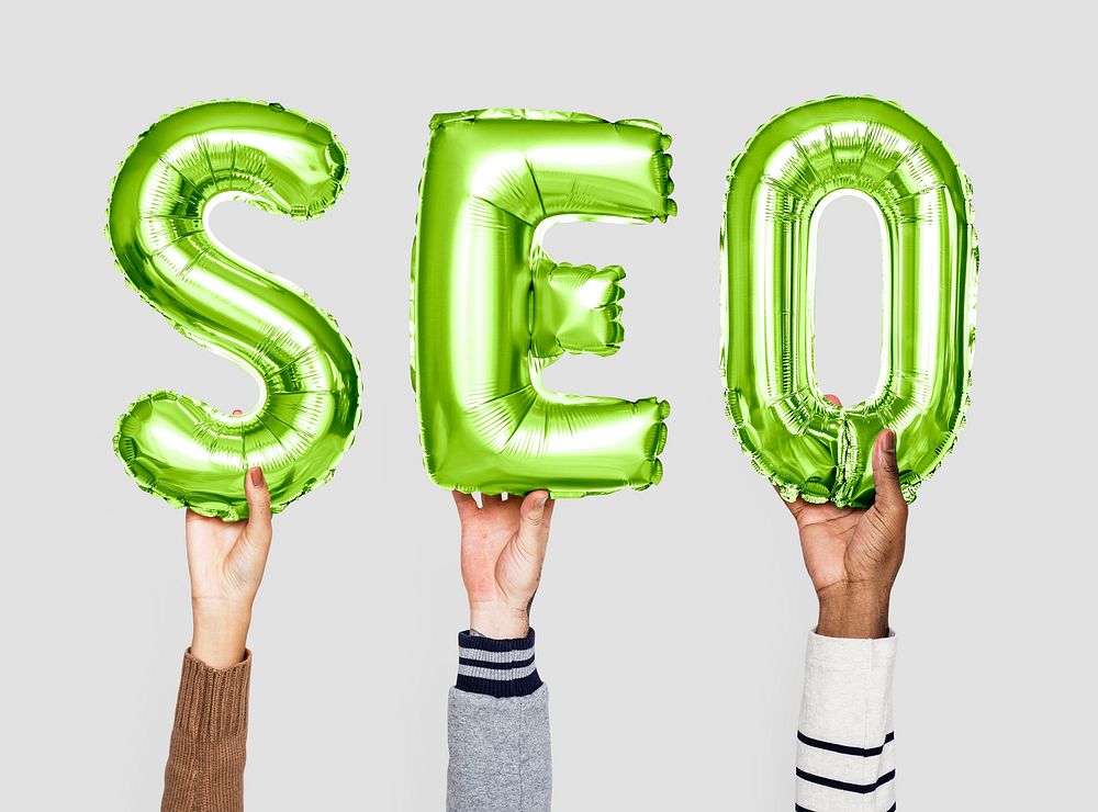 Green balloon letters forming the word SEO