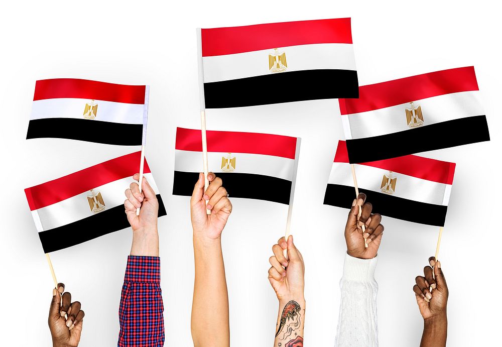 Hands waving the flags of Egypt