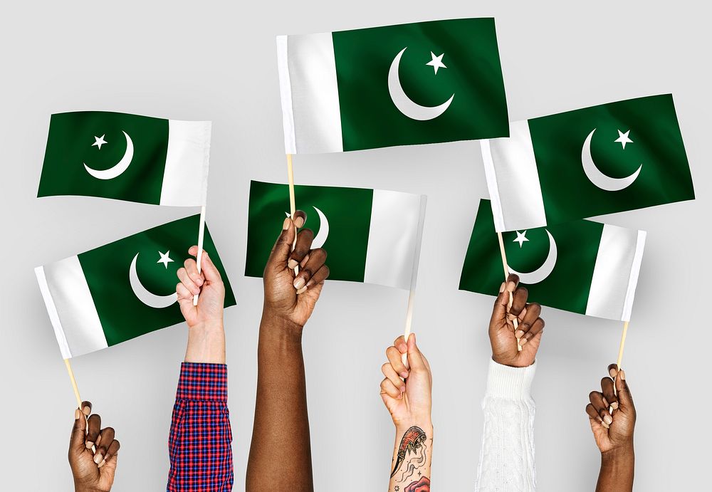 Hands waving flags of Pakistan