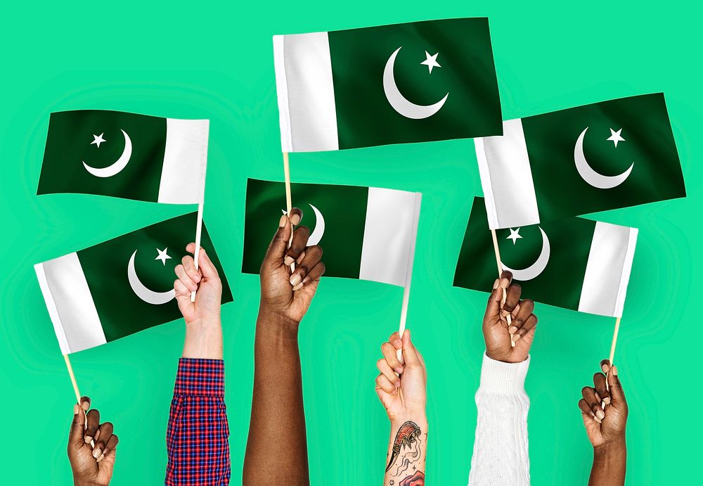 Hands waving flags of Pakistan