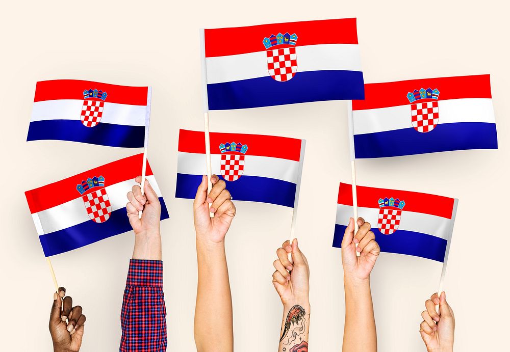 Hands waving the flags of Croatia