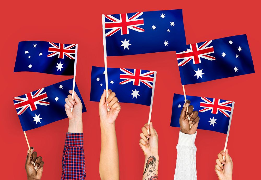 Hands waving Australia national flags