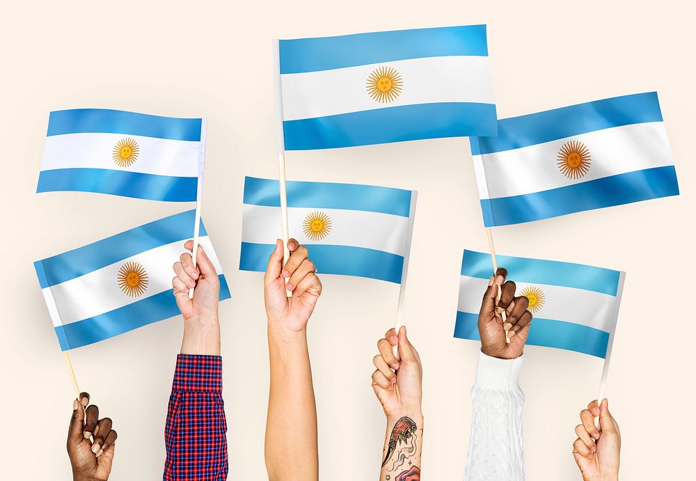Hands raising Argentina national flags