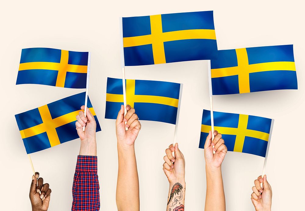 Hands raising Sweden national flags