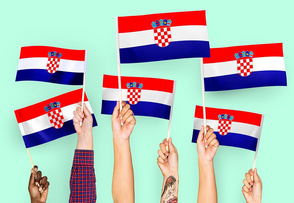 Hands waving the flags of Croatia