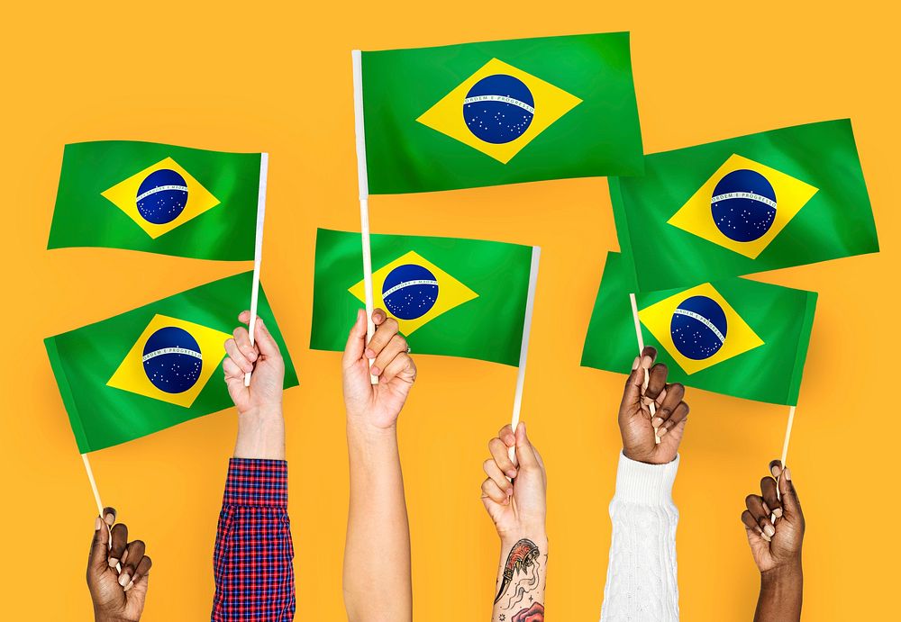 Hands waving the flags of Brazil