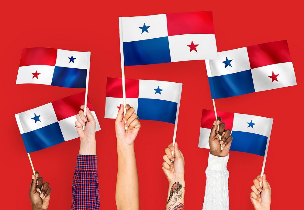 Hands waving the flags of Panama