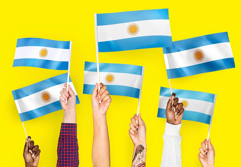 Hands waving the flags of Argentina