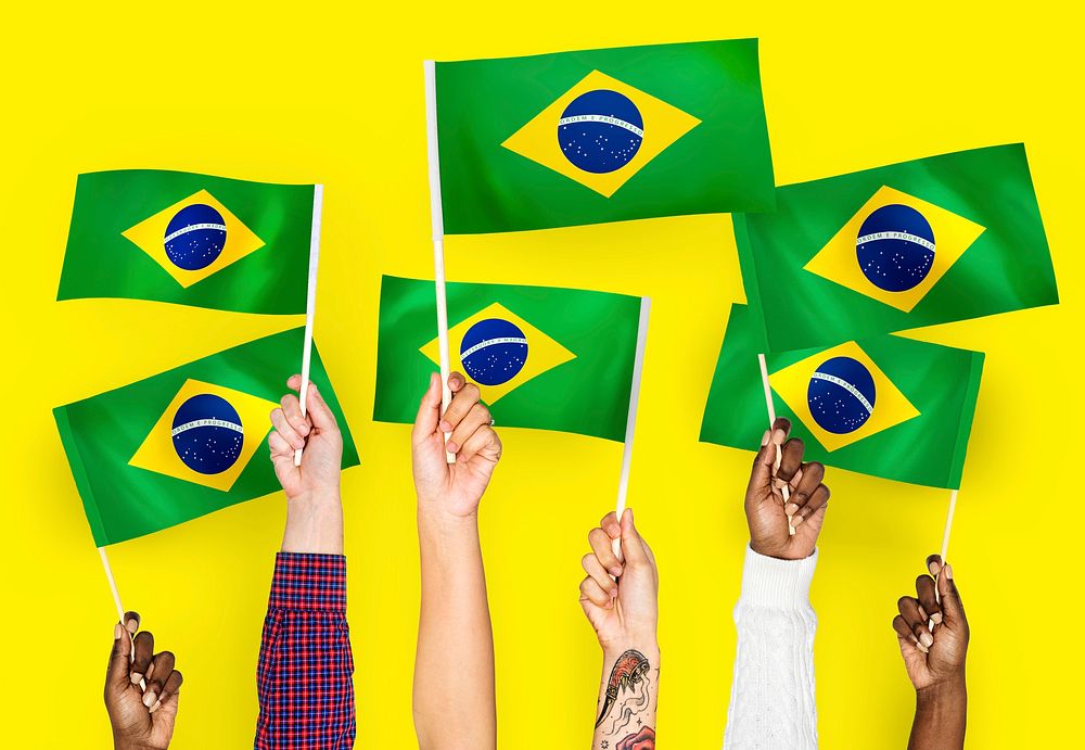 Hands waving the flags of Brazil