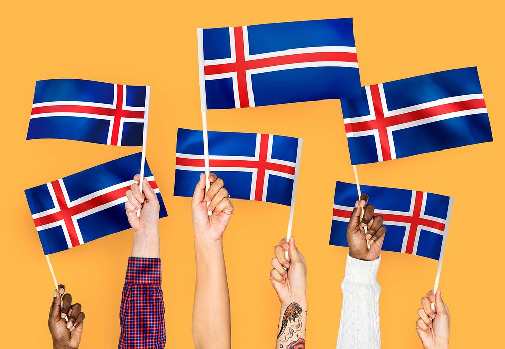 Hands waving the flags of Iceland