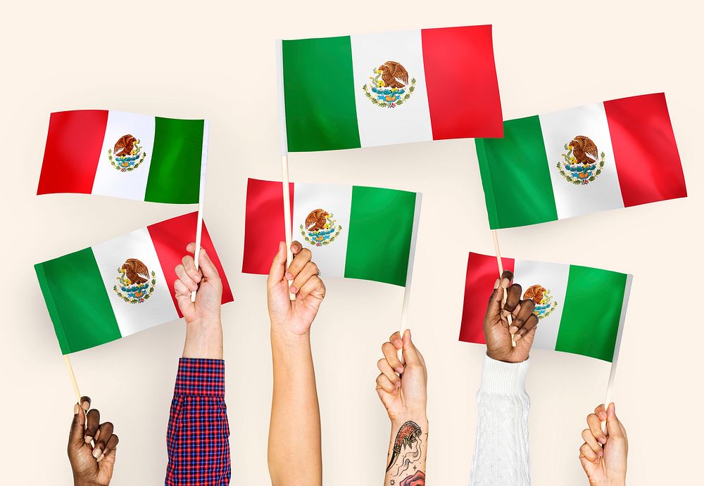Hands waving the flags of Mexico