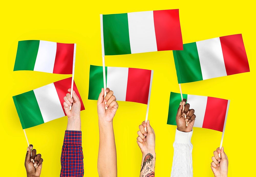 Hands waving flags of Italy
