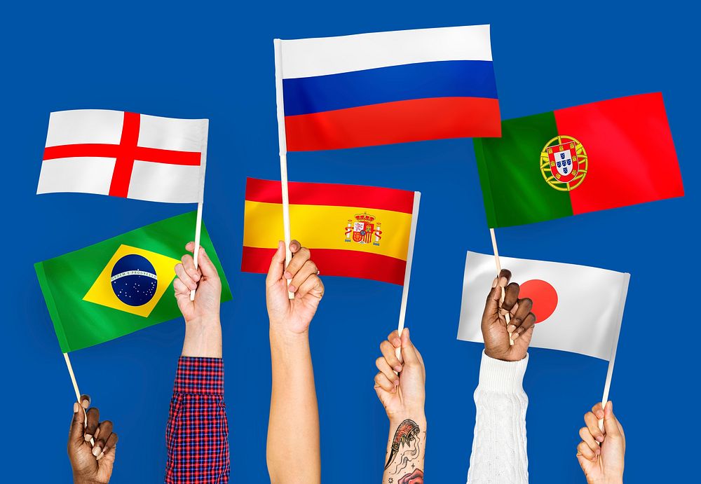 Hands waving the flags of England, Spain, Japan, Portugal, Russia, and Brazil