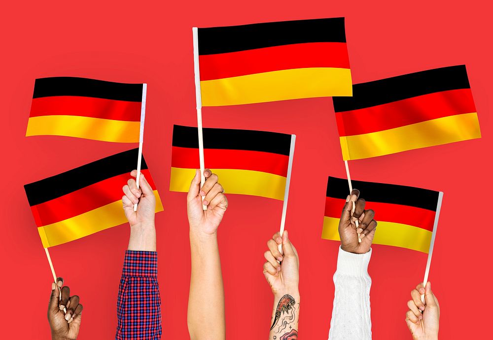 Hands waving the flags of Germany