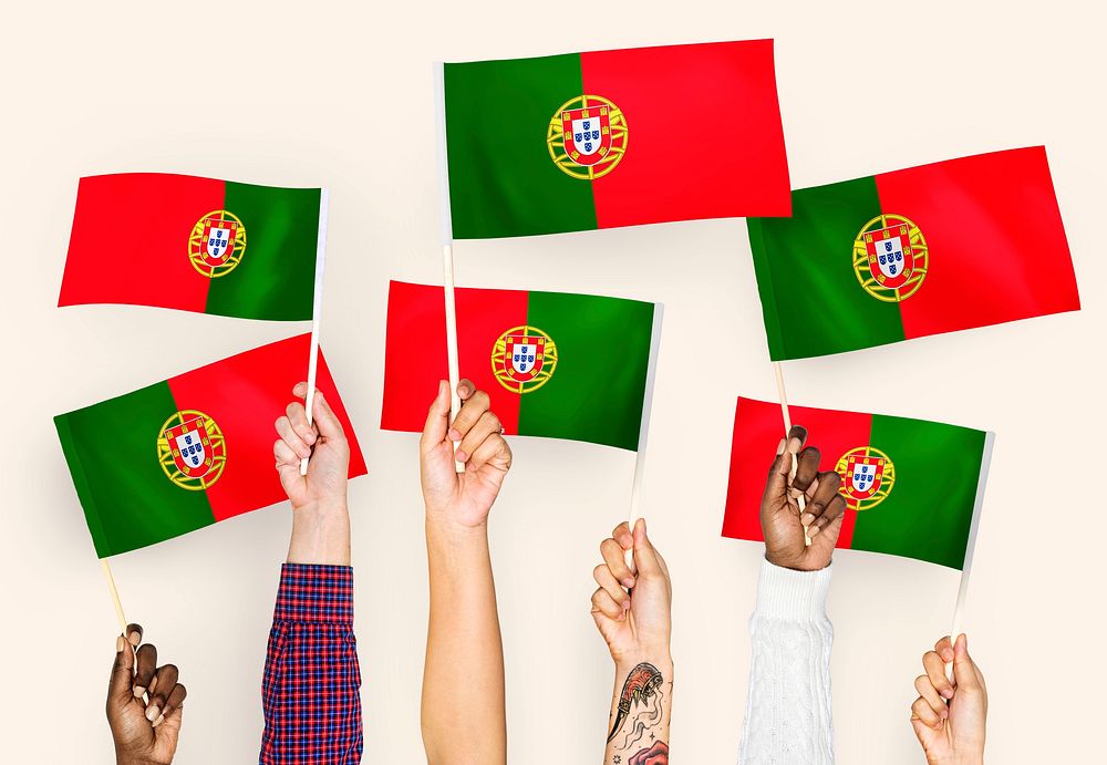 Hands waving the flags of Portugal