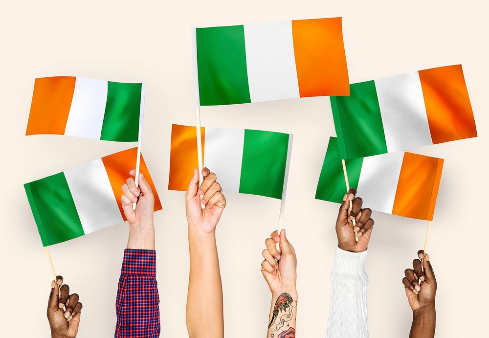 Hands waving flags of Ireland