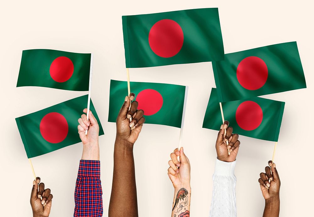 Hands waving flags of Bangladesh