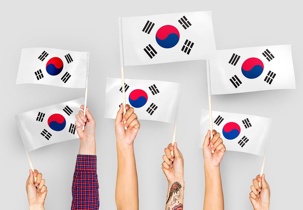 Hands waving the flags of South Korea