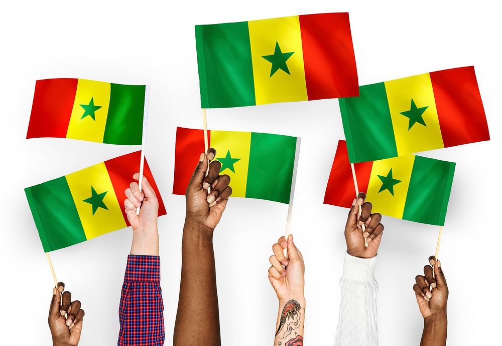 Hands waving the flags of Senegal